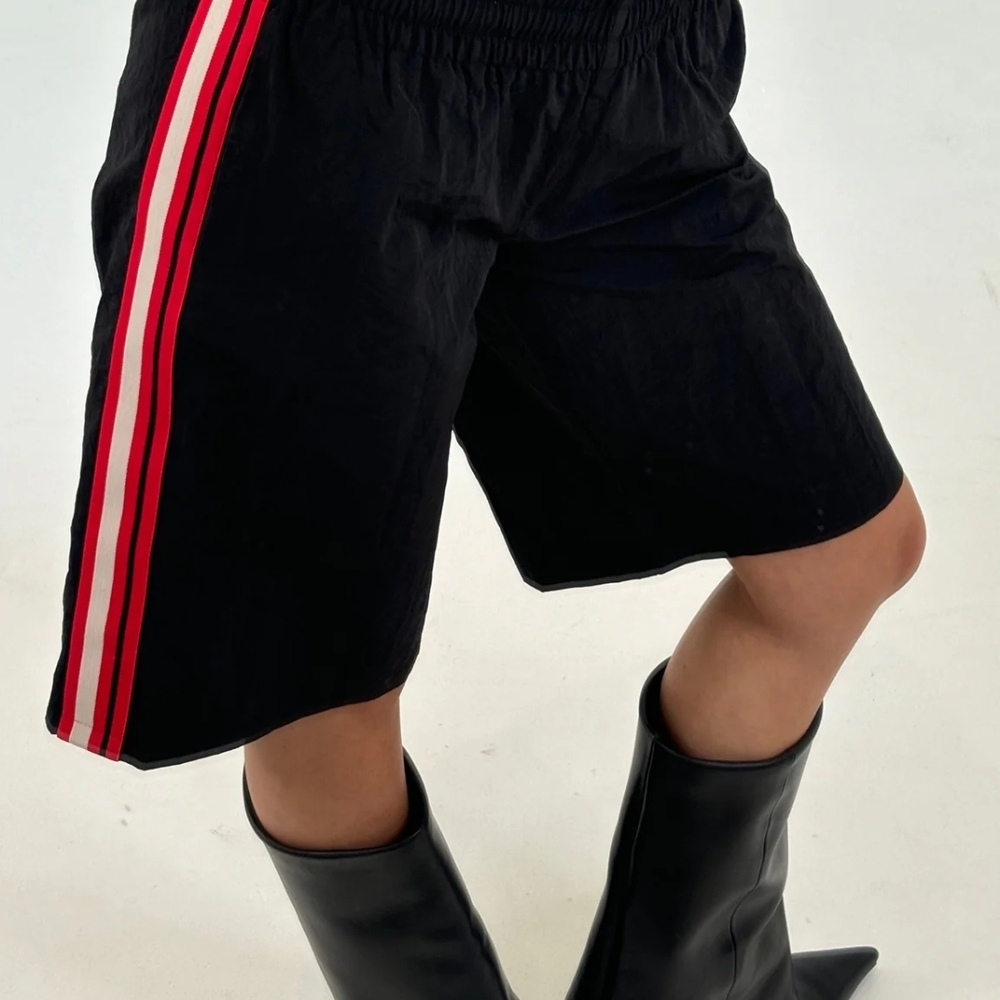 Lioness Black Shorts with Bold Red and White Stripes